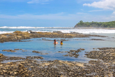 Playa Pelada Tide Pool Dad And Son Playing
 - Costa Rica